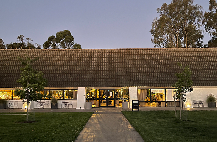 A winery and restaurant at dusk.