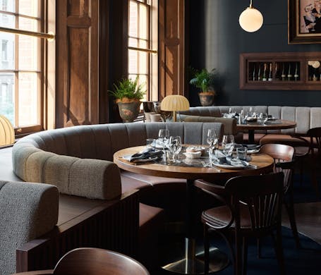 Plush booths in the luxurious dining room at The Sanderson restaurant in Sydney