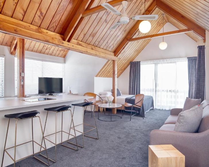 A spacious character suite at Carlton Mill, with wood accents.
