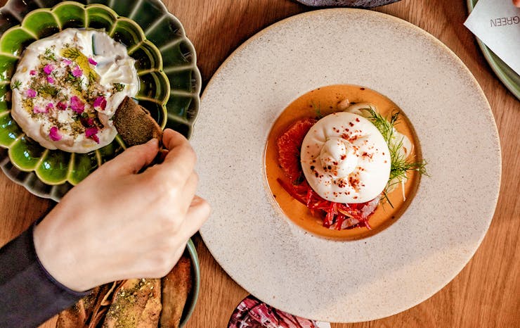 a burrata and another middle eastern dish