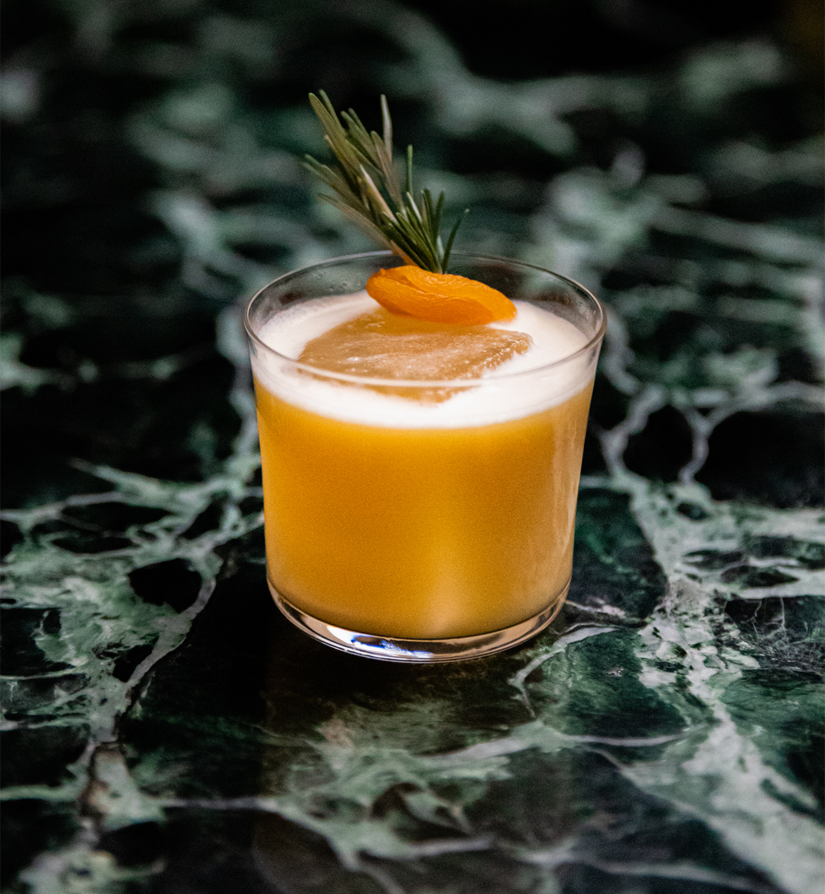 an apricot-topped cocktail
