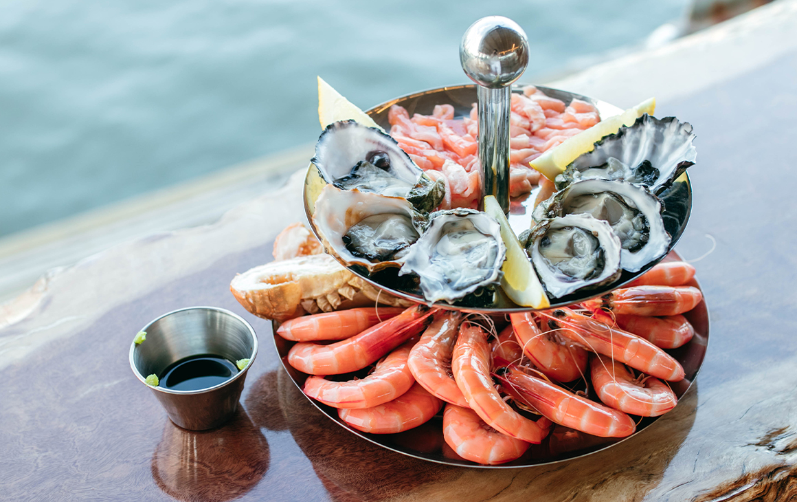 a double tiered tray of fresh seafood 