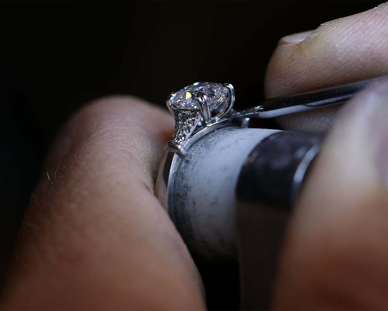 A close up view of someone crafting a delicate diamond ring at The Rolling Mill, one of the best jewellers in New Zealand.