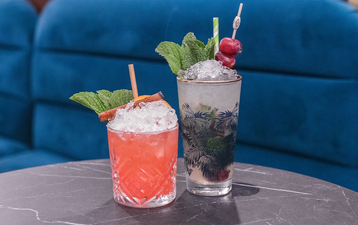 two cocktails on a table 