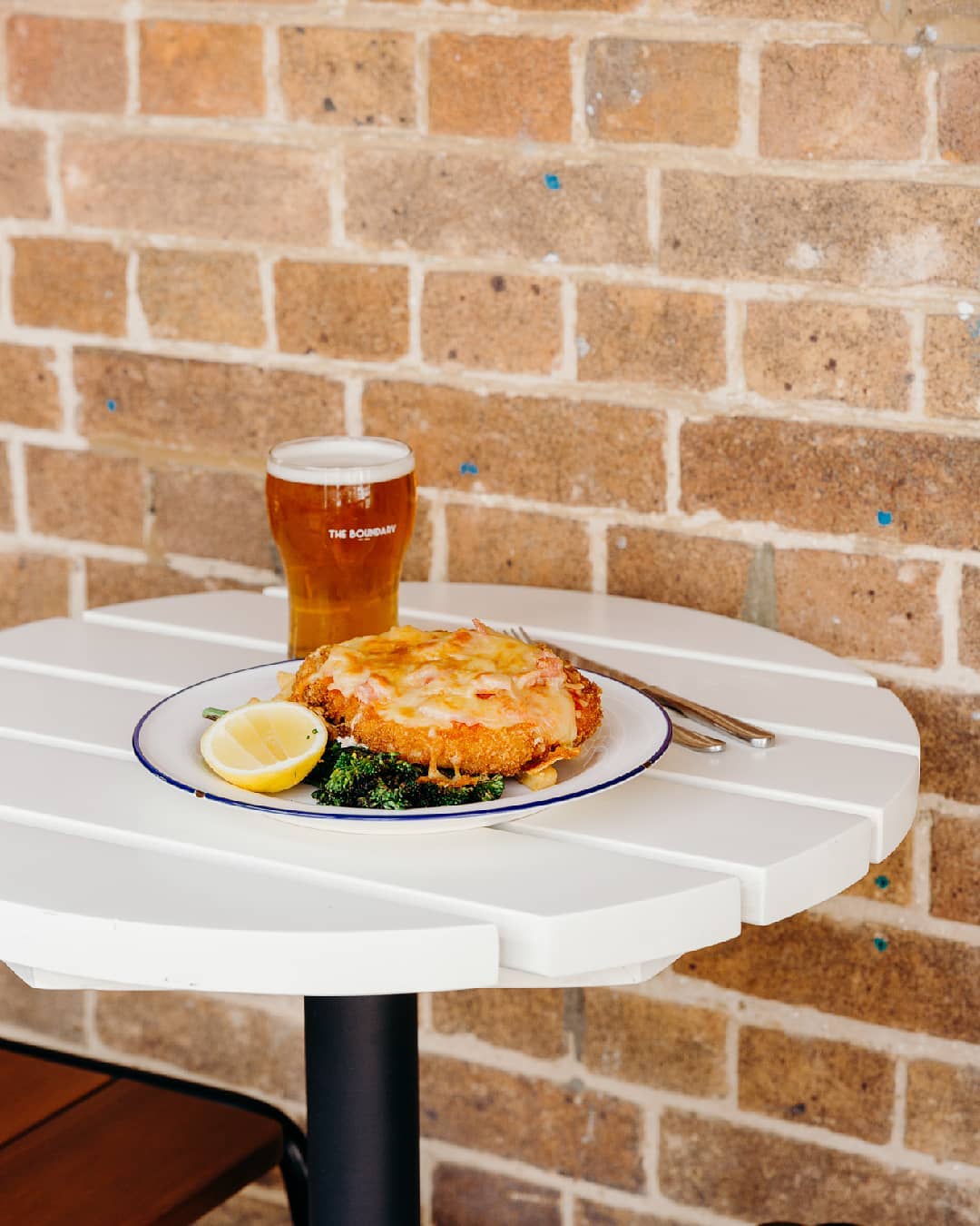 a chicken parmy and a beer