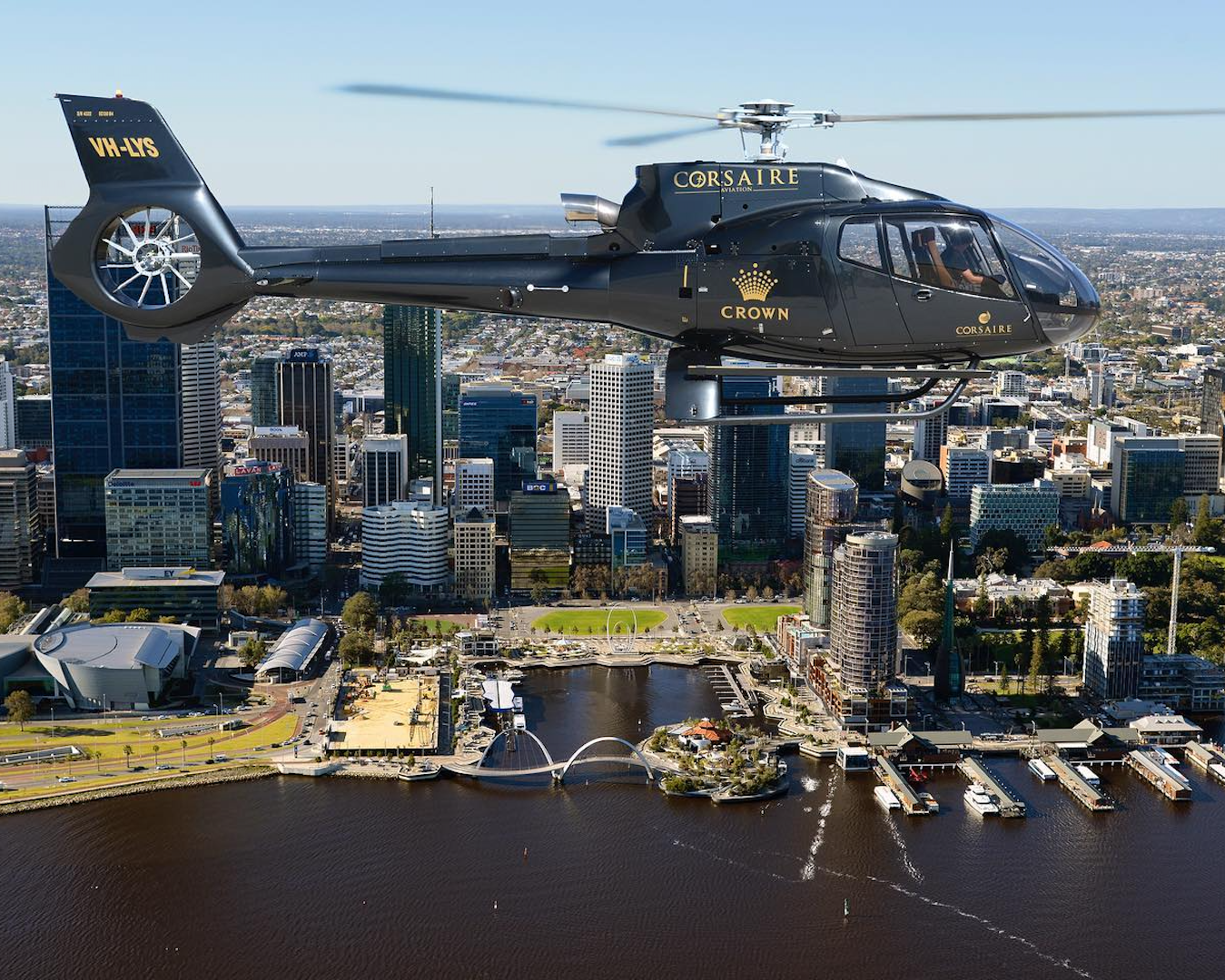 A helicopter flying over Elizabeth Quay in Perth