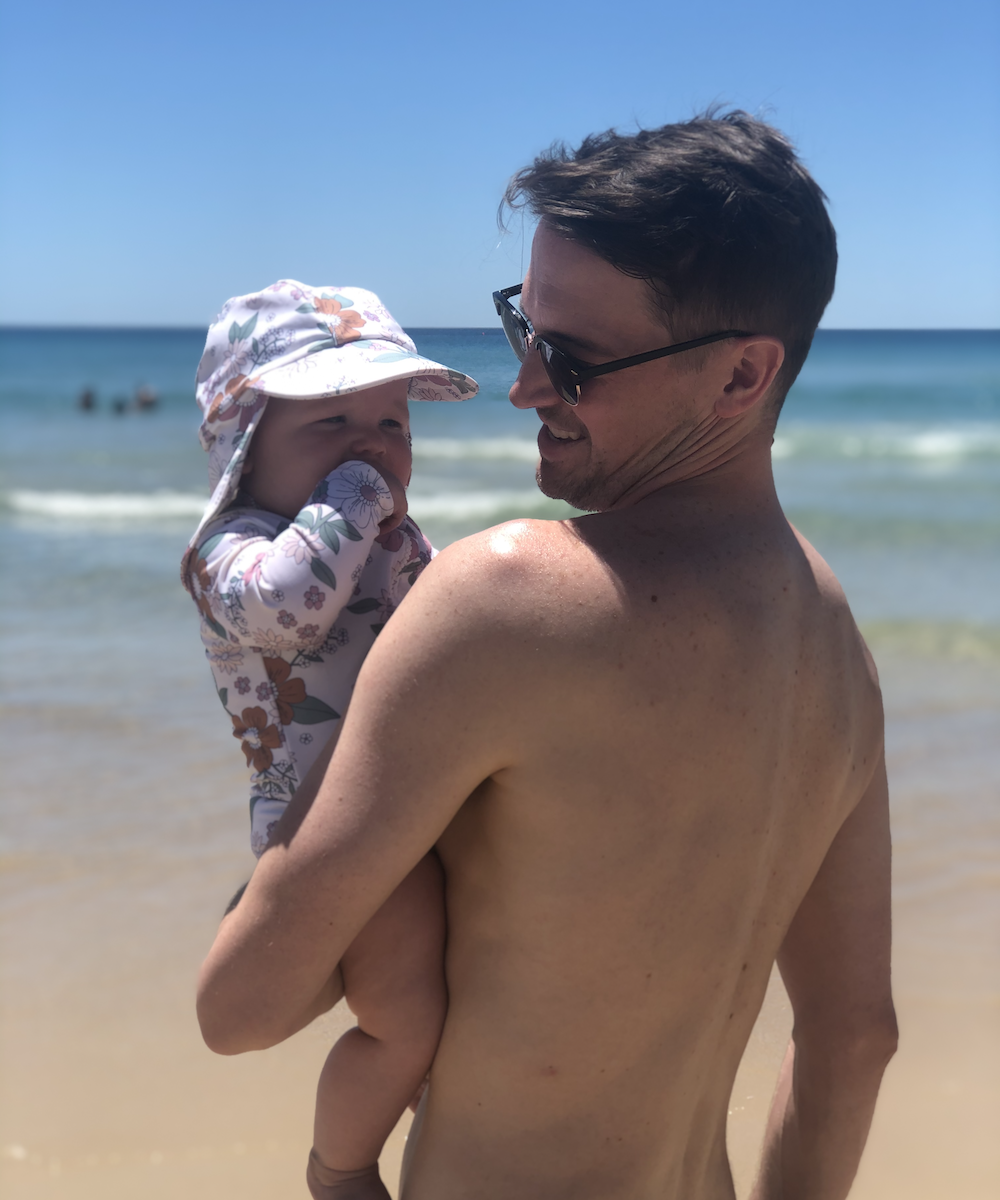 A father and child at the beach in Perth