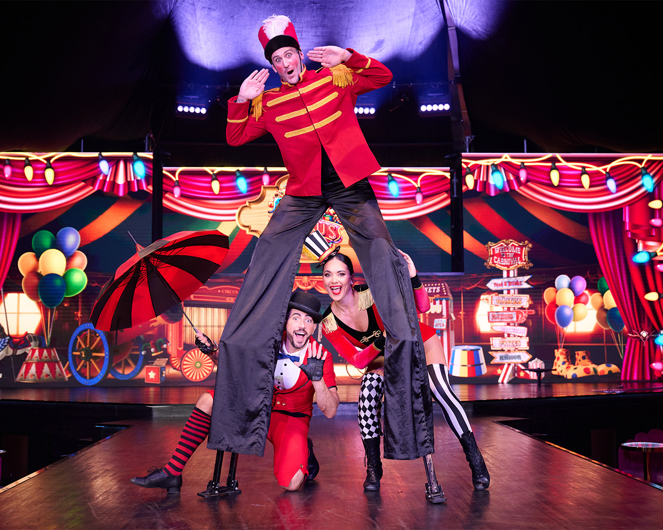 circus performers on a colourful stage