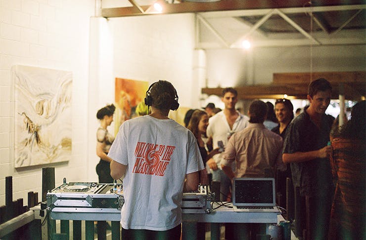 a DJ at an art gallery