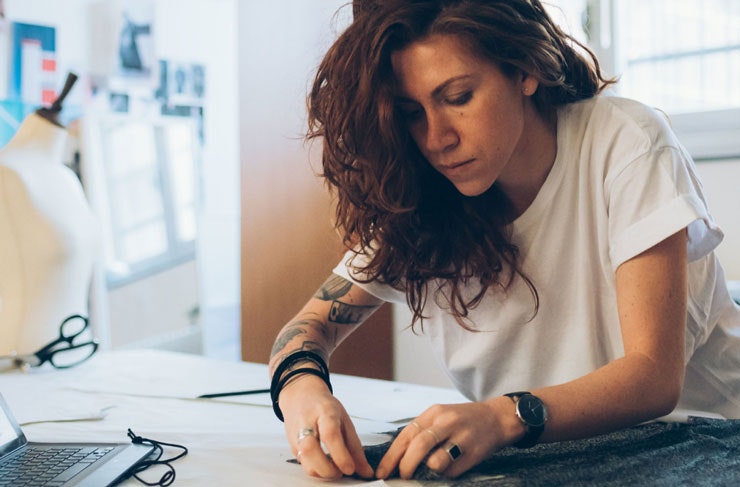 A designer working at her desk. 