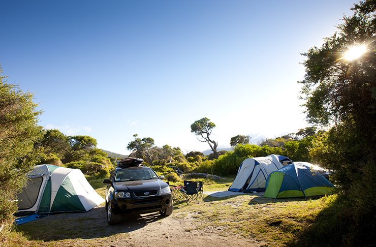 Two four wheeled drives parked at one of the best camping spots Victoria has to offer in 2021, Tidal River.