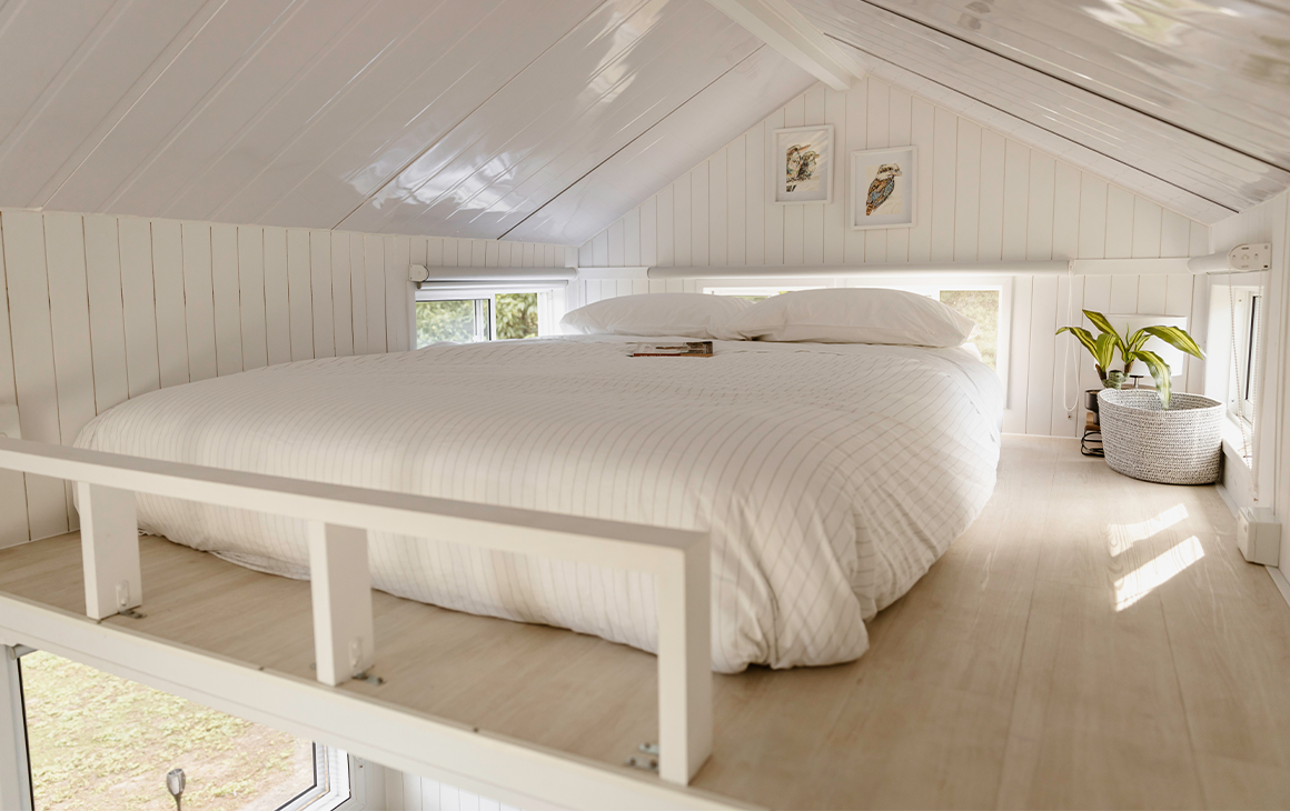 a loft bed in the tiny house