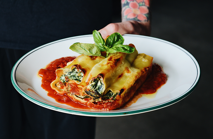 Tipico's famous spinach cannelloni covered in ricotta.