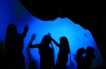 Children observe the iceberg at the exhibit of Titanic: The Human Story 