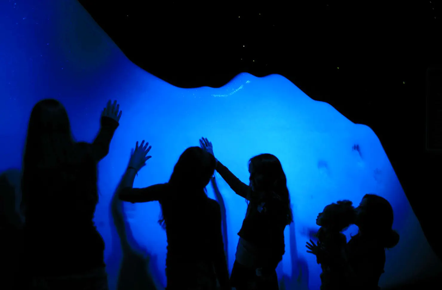 Children observe the iceberg at the exhibit of Titanic: The Human Story 