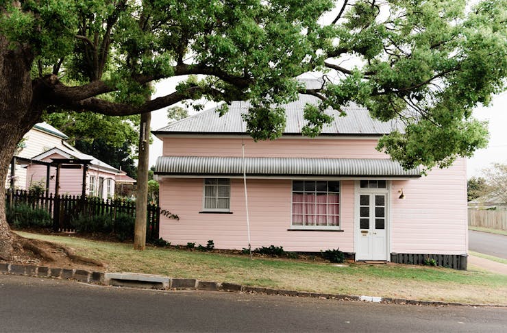 exterior of a cottage painted pink