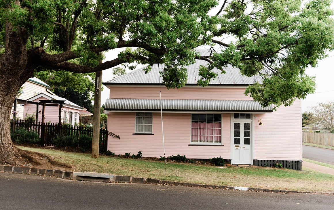 exterior of a cottage painted pink