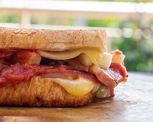 A close-up shot of a delicious, gooey toastie.