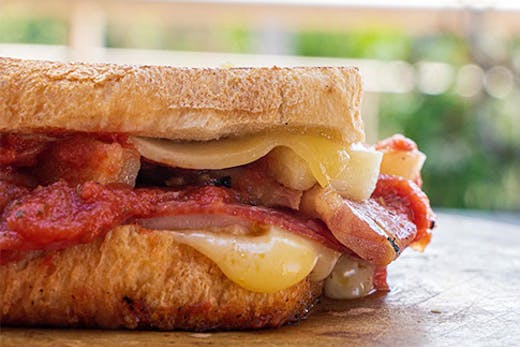 A close-up shot of a delicious, gooey toastie.