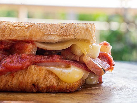 A close-up shot of a delicious, gooey toastie.