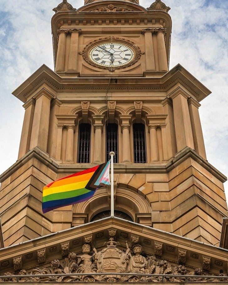town hall building pictured flying a pride flag