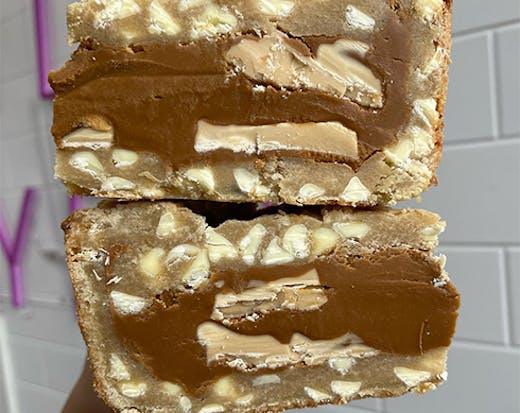 two cookie pie slices stuffed with caramilk