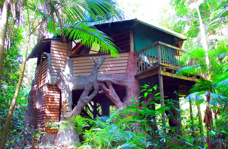 An octagon-shaped treehouse built in between several trees in Queensland's Daintree Forest.