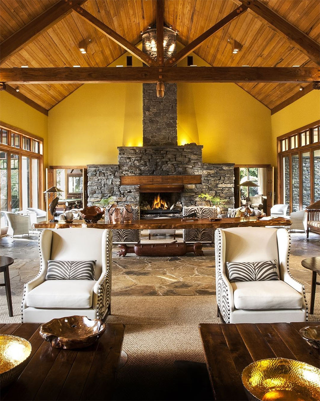 The Great Room at Treetops lodge and estate shows a fireplace in the background.