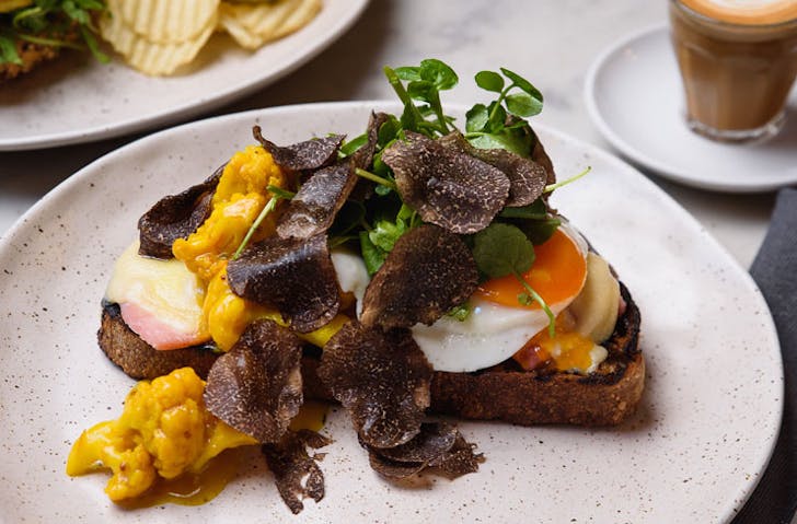 leg ham tartine that’s made with a truffle-infused fried egg