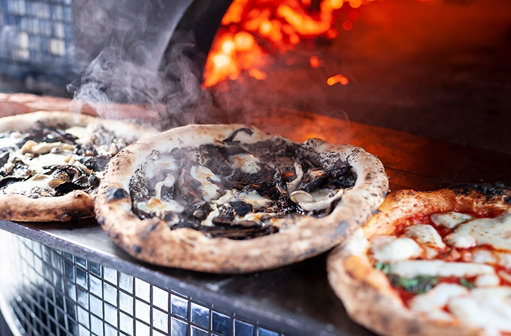 Pizza covered in truffle.