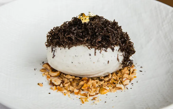 a bowl of truffle gelato topped with truffle shavings