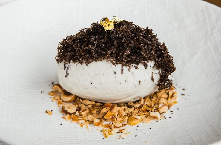 a bowl of truffle gelato topped with truffle shavings