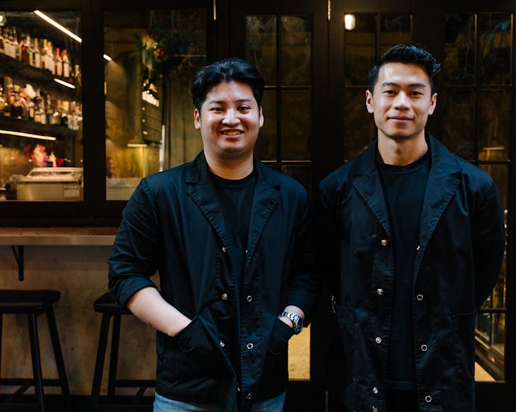 Theo Tjandra and Yovin Sius look chic standing outside their newly opened cocktail bar, Truth Or Dare. 