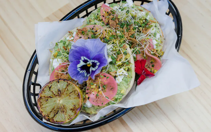 an avocado topped bagel