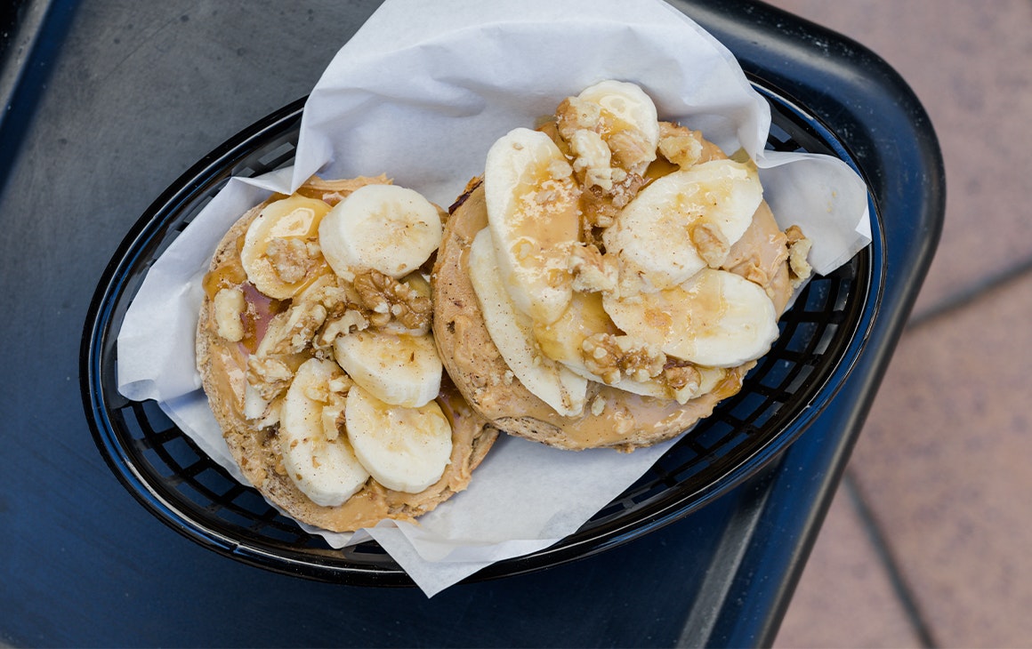 a banana and peanut butter topped bagel