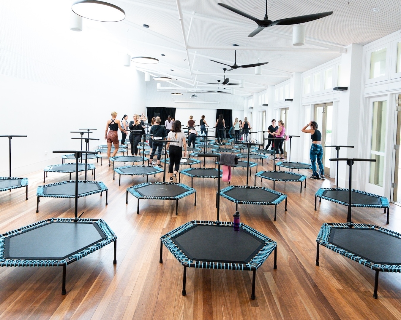 an exercise studio filled with mini trampolines
