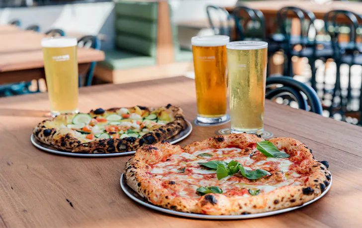 pizza and beer on a table