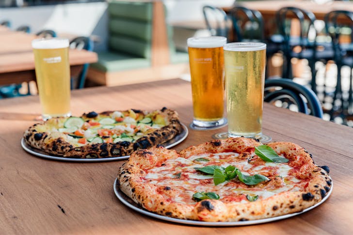 pizza and beer on a table