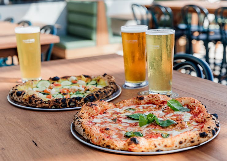 pizza and beer on a table
