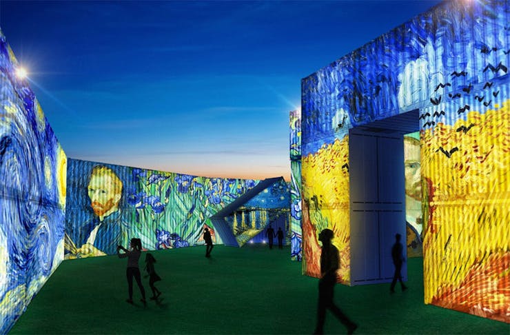 A render of the Van Gogh Alive exhibition showing people wandering amongst huge shipping containers.