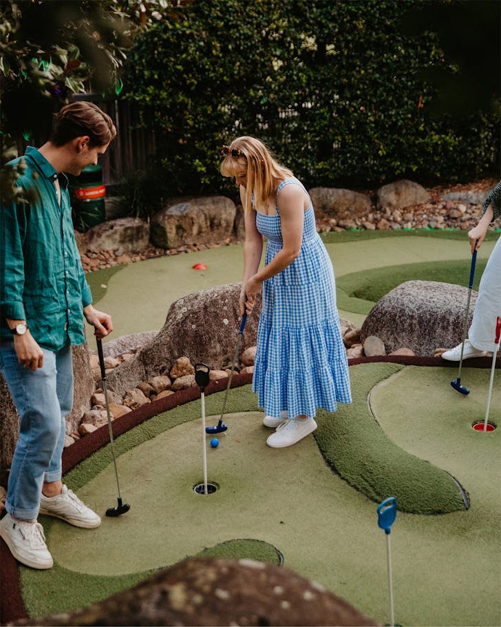 two people playing brisbane mini golf