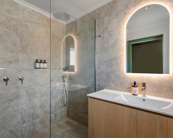 The sleek stone bathrooms at victoria street boutique hotel townsville.