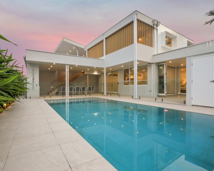 A boutique home with a large outdoor pool