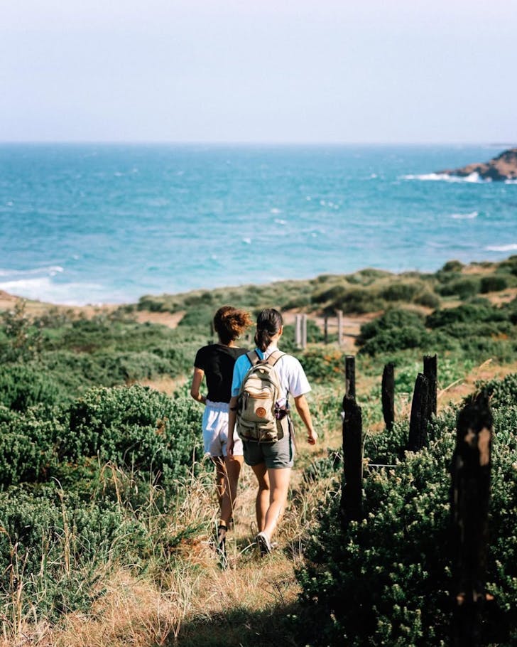 Two girls hike through the hinterland above lake macquarie