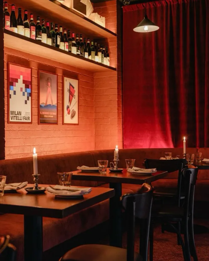 A red candlelit dining room at Vitelli's Upstairs in Wunderlich Lane
