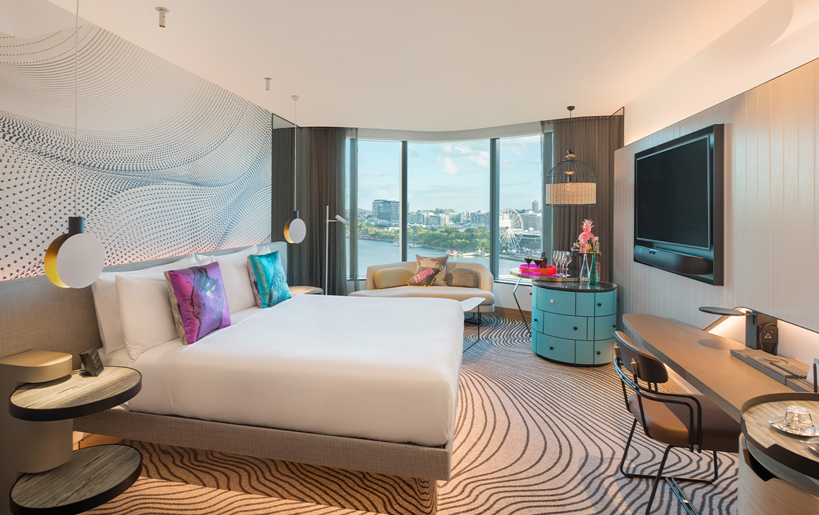 interior of a room at w brisbane, with a window overlooking the river
