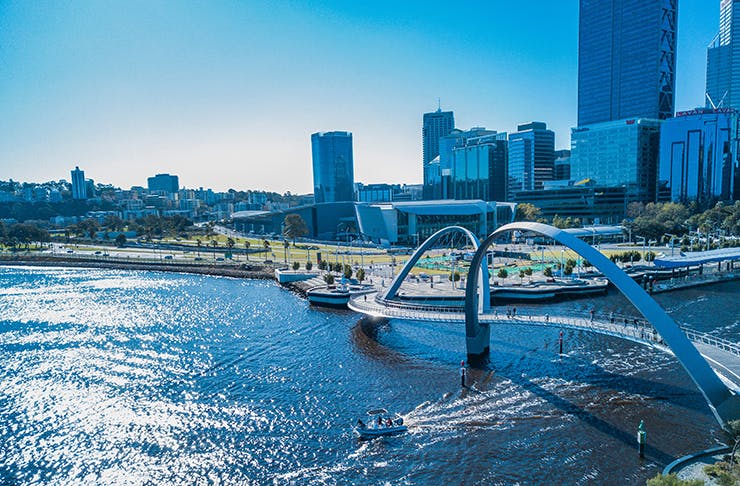A bridge passing over a waterway in Perth CBD on a sunny day.