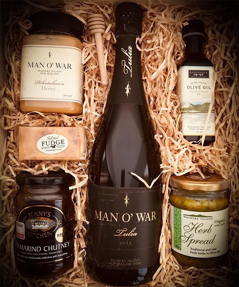 A gift box from Waiheke Hamper Co showing wine, honey and other assorted Waiheke goodies.
