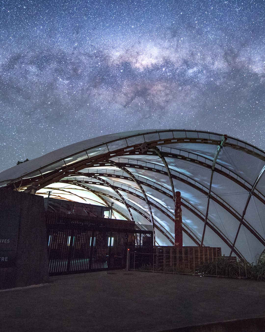 Waitomo Caves Township under a starlit sky.