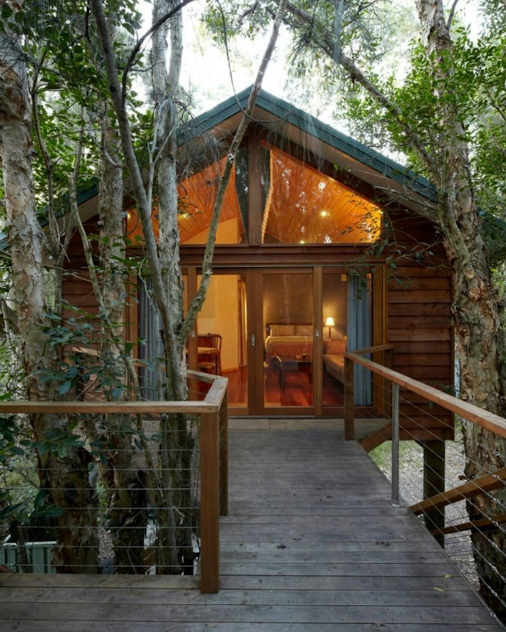 Wanderers Retreat Treehouse glowing entrance way and deck